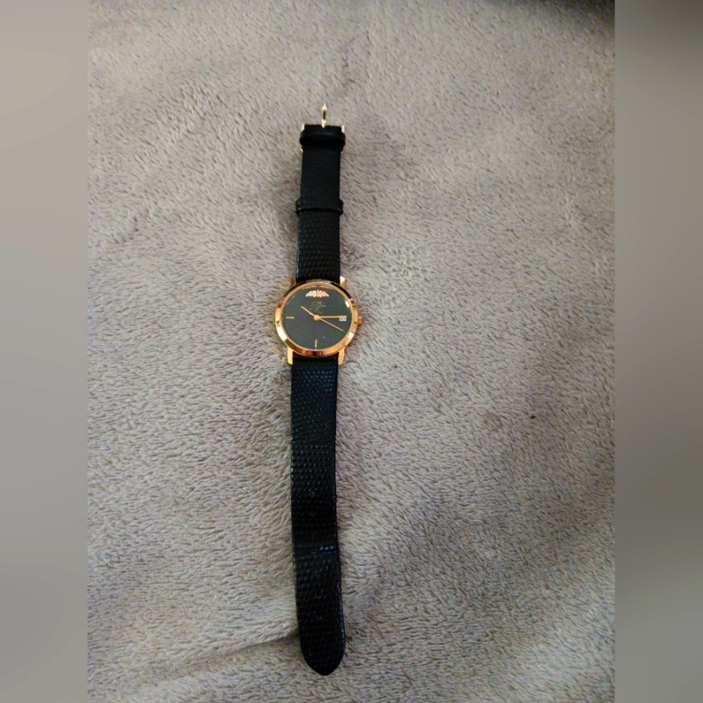 Landstrom black hill gold watch